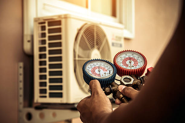 Professional Air Conditioning Service technician working in Yukon, PA